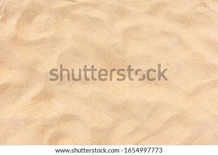 Sand nature texture in summer sun as background Royalty-Free Stock Photo #1654997773