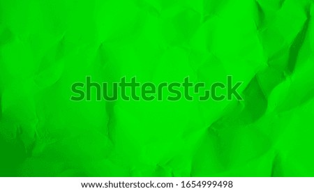green crumpled cardboard background. green paper
