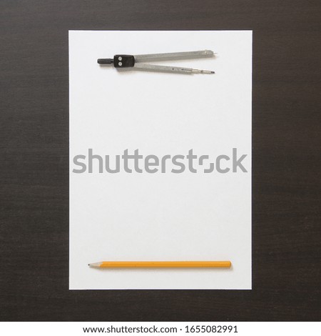 Template of white paper, divider and pencil on dark wenge color wooden background. Concept of business plan and strategy, development of content. Stock photo with empty space for text and design. 