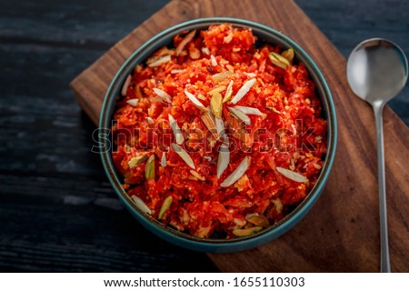 
Gajar ka halwa is a sweet dessert pudding from India made from carrot, served in a bowl. Garnished with cashew, almond and pistachio nuts. Royalty-Free Stock Photo #1655110303
