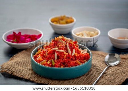 
Gajar ka halwa is a sweet dessert pudding from India made from carrot, served in a bowl. Garnished with cashew, almond and pistachio nuts. Royalty-Free Stock Photo #1655110318