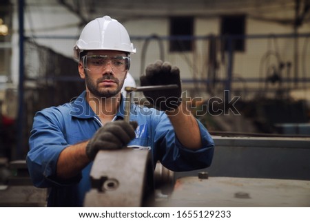 Engineers and skilled technicians are maintaining machinery. Technicians and engineers are working and repairing machines in industrial plants. Royalty-Free Stock Photo #1655129233