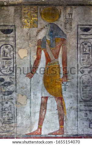 Ancient egypt carving color image of Horus god on wall of temple