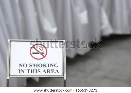 No smoking sign in the area.  selective focus.