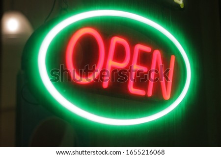Open neon sign light at night