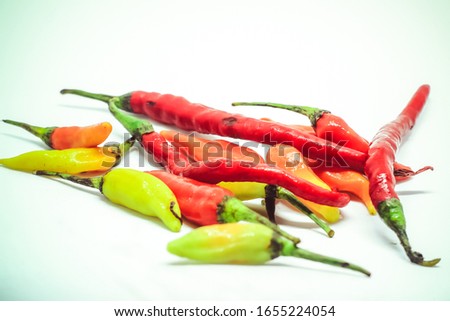 chili, coriander, candlenut as ingredients in the photo with a separate white background. chili is a spice to add spicy flavor to the cuisine. chili also has a high vitamin C content