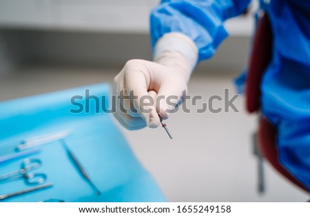 Stomatology instruments in dentist's hands. Tools close-up. Dentistry. Stomatological tools. Healthy teeth concept