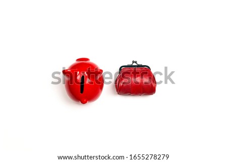 Red piggy bank and purse on white background. Finance, savings, money concept.