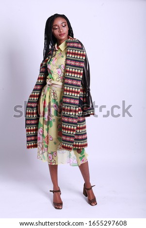 Fashion Model girl full length portrait isolated on white background. Beauty stylish black woman posing in fashionable clothes in studio. Casual style, beauty accessories. High fashion urban style

