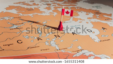 flag of Canada on Canada Map Royalty-Free Stock Photo #1655311408