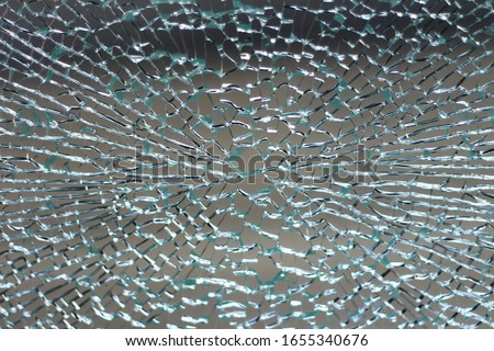 Broken glass wall outdoor background Royalty-Free Stock Photo #1655340676