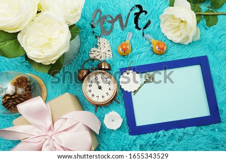 Mock-up space Photo Frame with alarm clock and peony flower Decoration