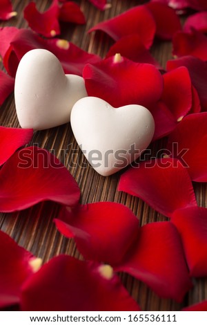 Rose petals and stone hearts.