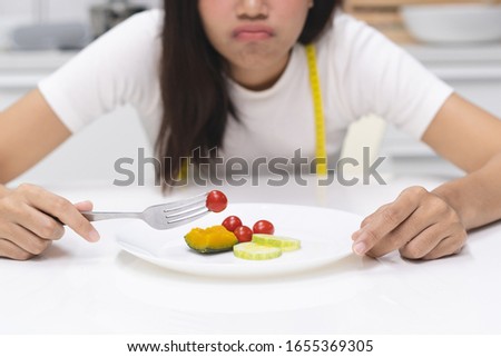Disorder diet eat. woman want to slim and use wrong solution to lose her weight and eating less food. Royalty-Free Stock Photo #1655369305