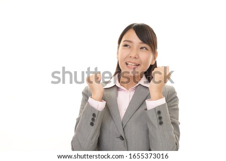 The female office worker who poses happily.