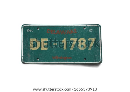 Old car plate isolated on white background. Vintage frame