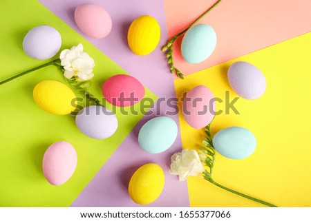 Easter eggs on multicolored background. Top view