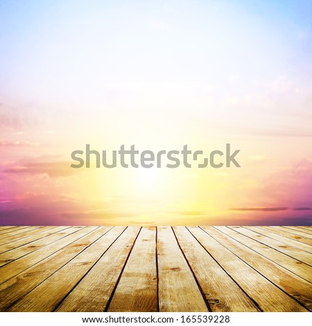 blue sky with clouds and wood planks floor background Royalty-Free Stock Photo #165539228