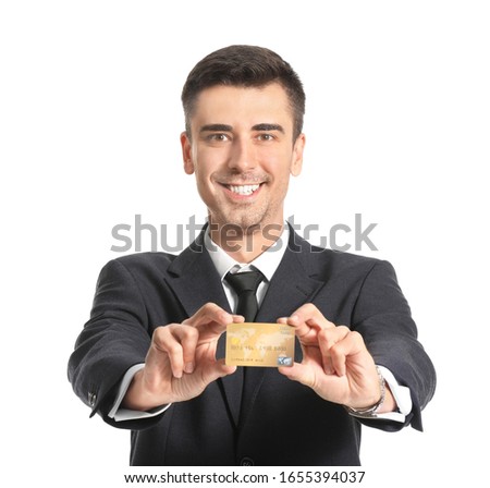 Happy male bank manager with credit card on white background