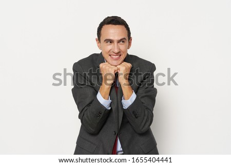 Business man success hands in fist emotions