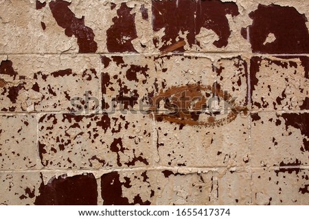 old brick wall with peeling paint