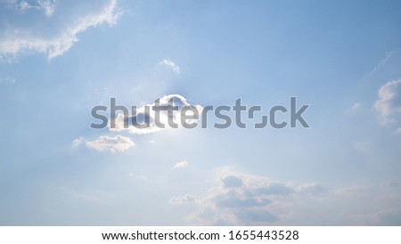Stunning  blue sky horizontal with beautiful puffy fluffy clouds with sunlight, abstract nature background