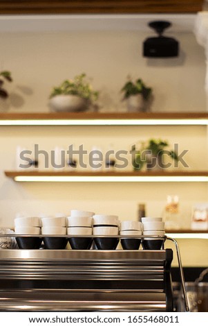 Modern simple cafe interior, coffee cups.