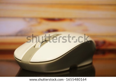 It is a white colored wireless computer mouse. Good for PowerPoint and web design.
