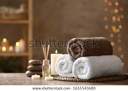 Beautiful composition with spa stones on grey marble table Royalty-Free Stock Photo #1655543680