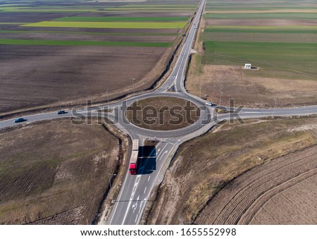 Aerial drone view of traffic roundabout in Vojvodina,Serbia. New road near city of Subotica. Royalty-Free Stock Photo #1655552998