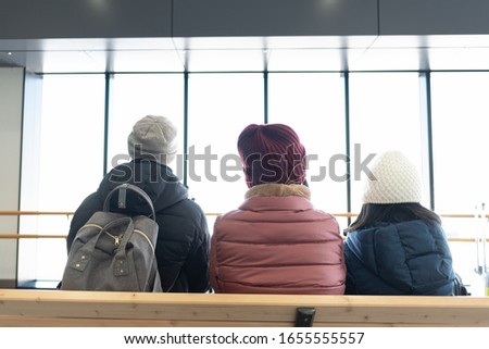 Close up of family waitng at the station