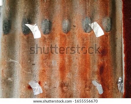 Old zinc background in vintage style for graphic design or wallpaper. Rusted wall texture on metal sheets in retro concept.