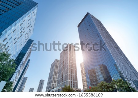Urban road and modern office building of Ningbo business distric Royalty-Free Stock Photo #1655586109