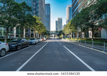 Urban road and modern office building of Ningbo business distric Royalty-Free Stock Photo #1655586130