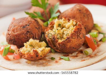 Falafel, middle eastern deep fried chickpea balls with pita bread Royalty-Free Stock Photo #165558782