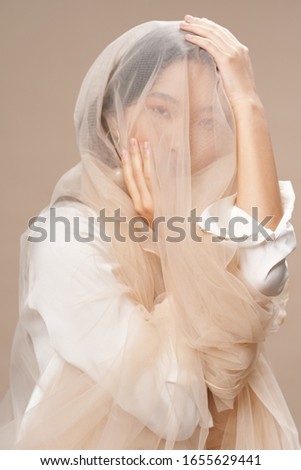 Beautiful woman charm transparent fabric lifestyle beige luxury background