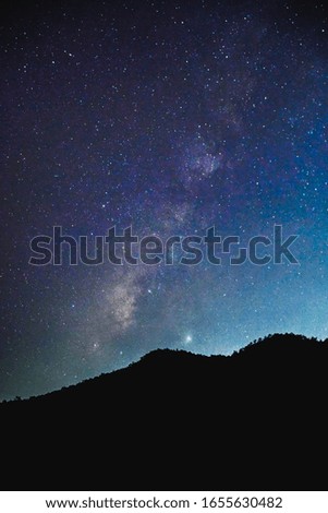 Milky Way up from behind a mountain