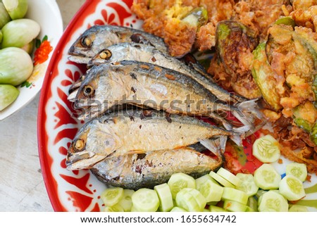 set of Thai dinner it call Namprik Kapi or Traditional Southeast Asian appetizer Thai food spicy shrimp chili paste to dip fresh vegetables with fried fish or Pla Too. famous food in Thailand. 