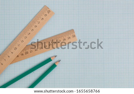 pencils end engineering ruler on graph paper with copy space