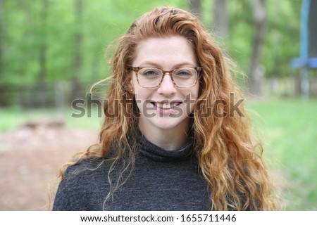 Profile picture of a young adult outside.