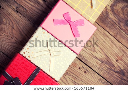 colorful gift boxes on wooden background