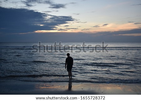 Man on the beach in Jacksonville Beach, FLorida.  