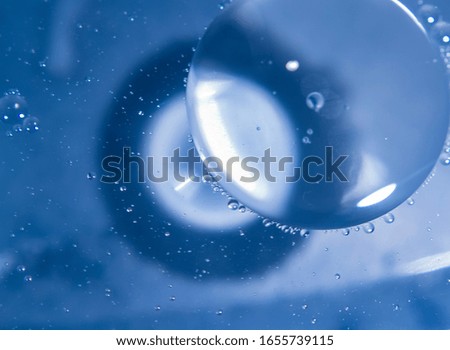 Abstract blue background, bubbles and reflections