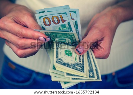 Exchange rate, Very happy girl with money in hand, girl counts dollars, close-up, woman hands counting us dollar banknotes 