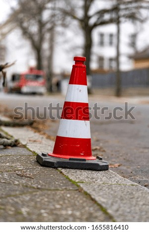 traffic cones on the road, red white with a blurred background 
