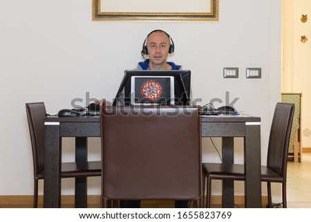 Man Works from Home Because of the Cornavirus: smartworking. Royalty-Free Stock Photo #1655823769