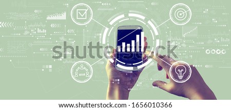 Marketing concept with person holding a white smartphone