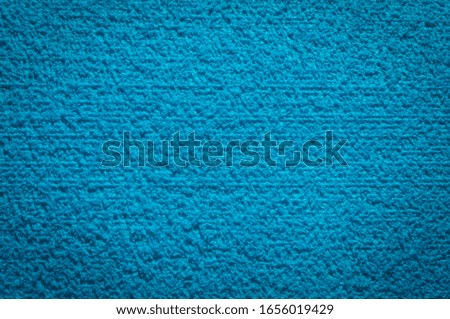 textured fabric trendy blue surface for background and wallpaper with dark vignetting gradient