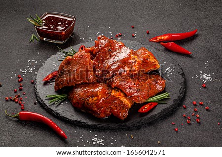 Shooting for the catalog. Raw meat products, different parts of the body. pork, beef, chicken. background image, copy space text Royalty-Free Stock Photo #1656042571