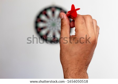 Aiming a dart at dart board